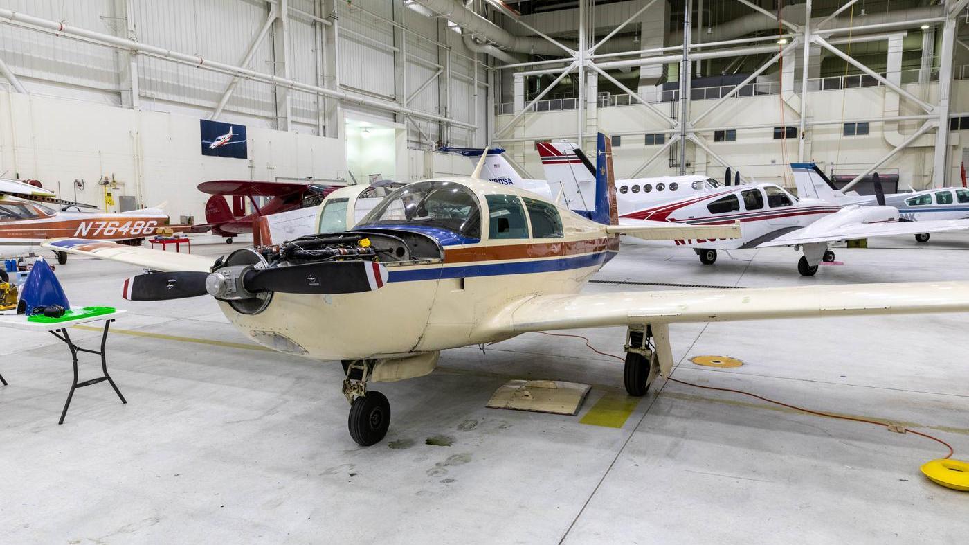 UMA AMTS program airplane with hood open in Hangar 6