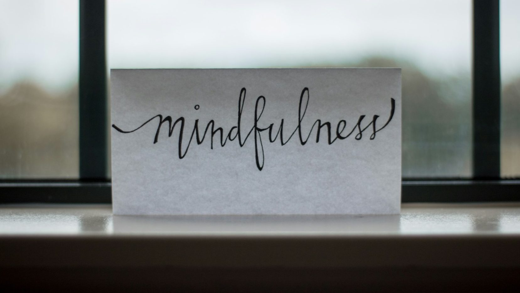 A sign displaying the word "Mindfulness" in cursive