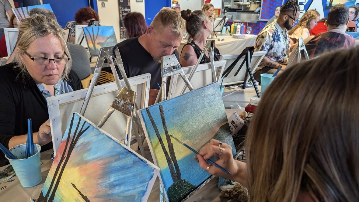 LAC Paint Party participants focused on their canvases