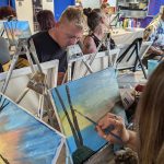 LAC Paint Party participants focused on their canvases