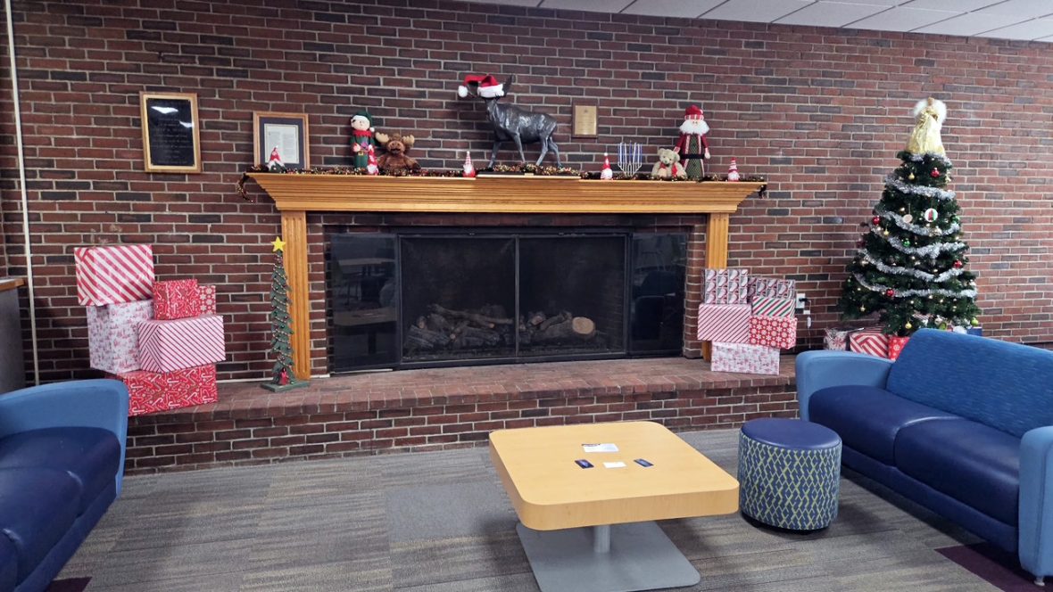 eastport hall huskins lounge fireplace decorated for holiday season 16x9