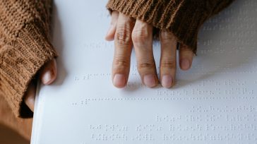 Hands reading braille