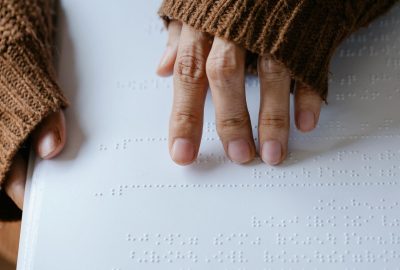 Hands reading braille