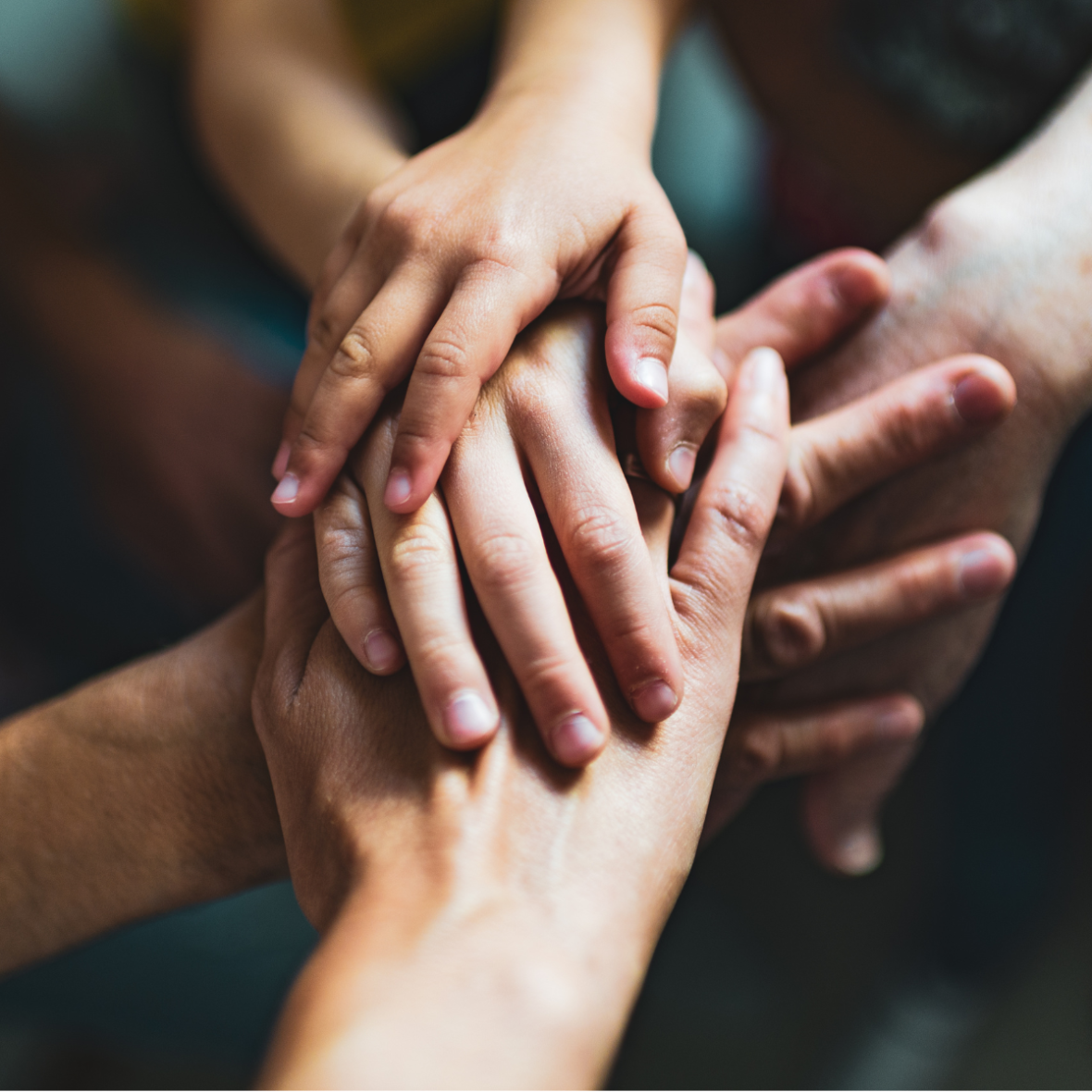 hands piled on top of each other