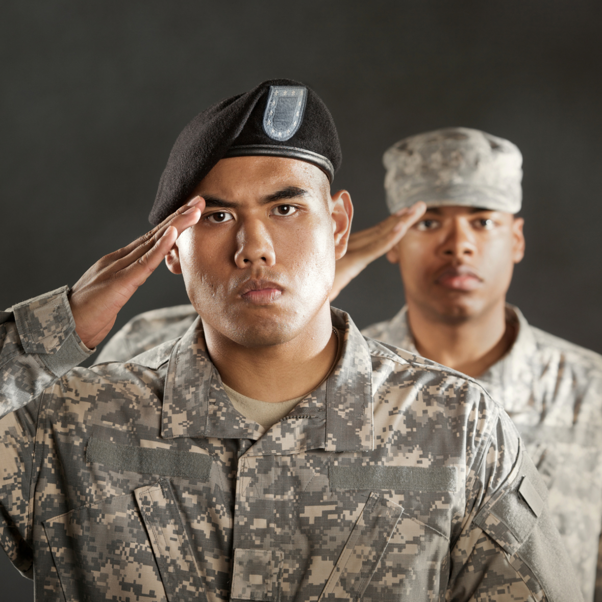 two servicemen saluting