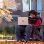 UMA student at a computer