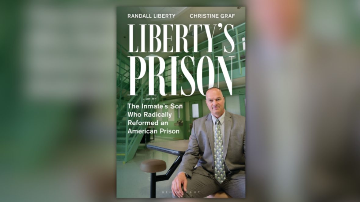 Book cover for Liberty’s Prison by Randall Liberty and Christine Graf. The cover shows a man in a suit seated inside a green-painted prison cell block with metal stairs and railings behind him. Large white title text reads “Liberty’s Prison,” with the subtitle “The Inmate’s Son Who Radically Reformed an American Prison.”