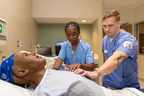 uma students with nursing sim in capital center
