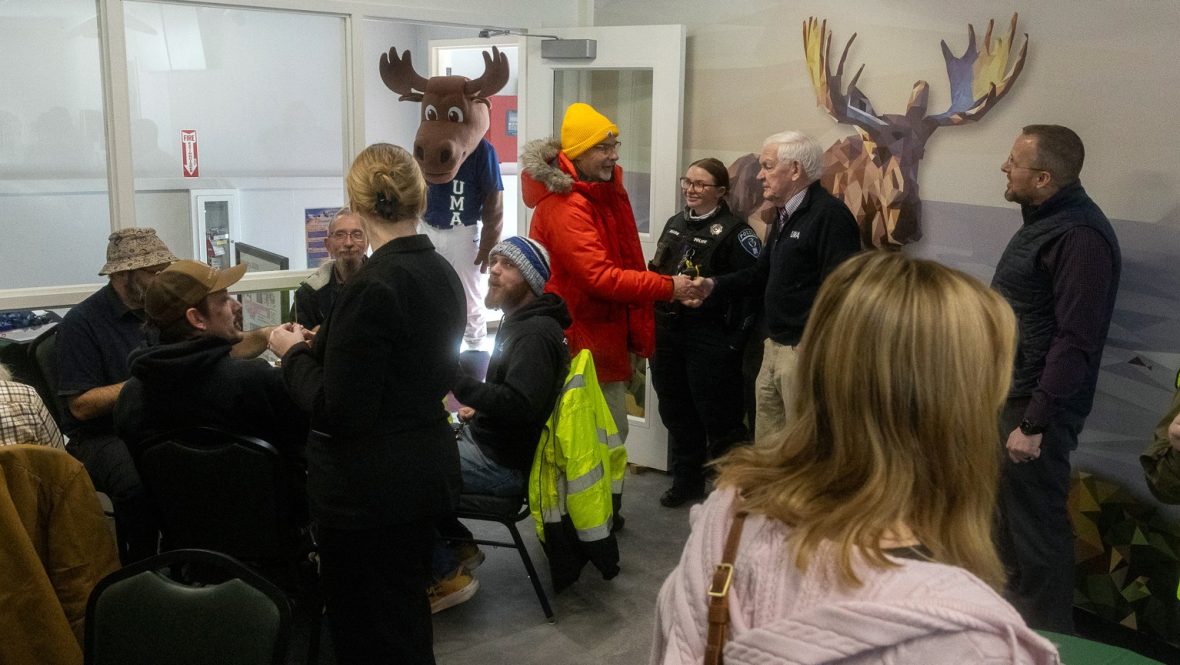 Augustus, UMA's moose mascot enters the Hungry Moose Café while patrons enjoy good food and conversation. 