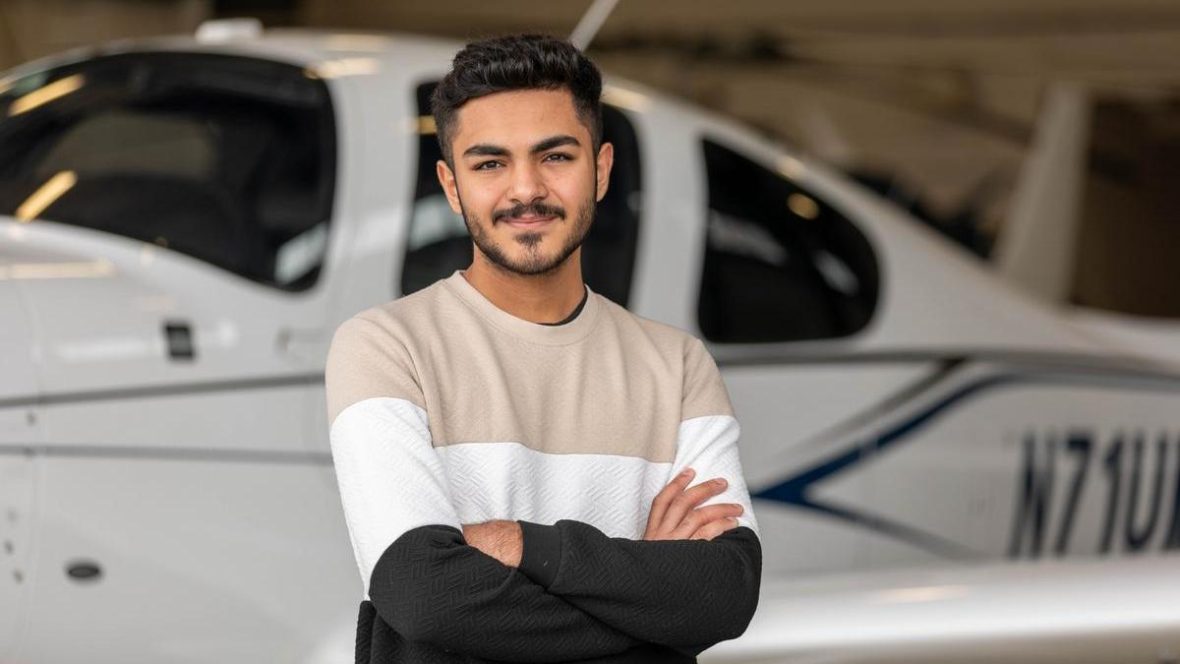 UMA AViation student portrait in front of plane