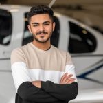 UMA AViation student portrait in front of plane