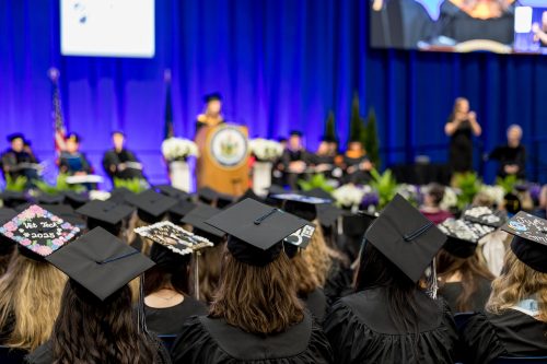 uma graduates at commencement
