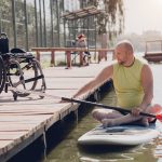 person with a physical disability ride on sup board