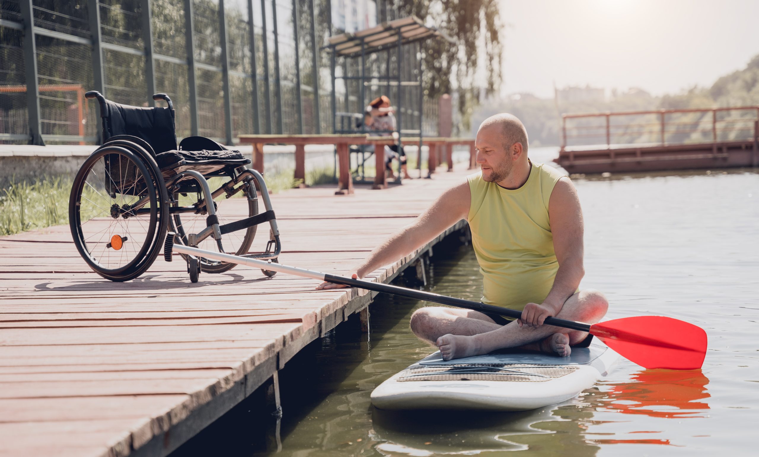 person with a physical disability ride on sup board