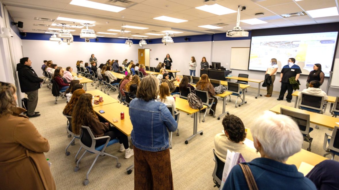 High school students sit in a UMA classroom while faculty and staff present information during a Medical Bootcamp health care career exploration event.