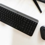 A logitech keyboard and mouse on a desk.