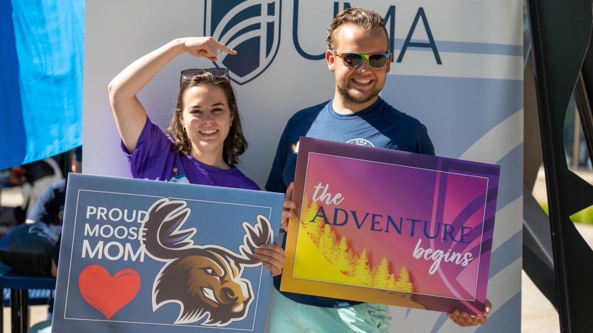 Employees Liz and Duncan at last year's Accepted Student Day photo booth