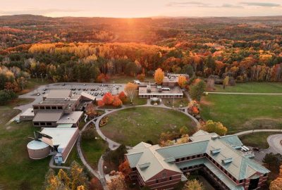 Aerial photo of UMA Augusta quad and surrounding buildings in sunset lighting