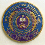 Justice Impacted Student Club medallion for the University of Maine at Augusta, featuring blue, purple, and gold colors, laurel branches, an open book and torch, and the words “Breaking Barriers, Elevating Voices” and “Est. 2026.”