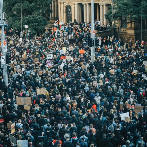 A crowd of people at a protest rally
