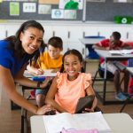 portrait of african american female teacher and disabled girl sm